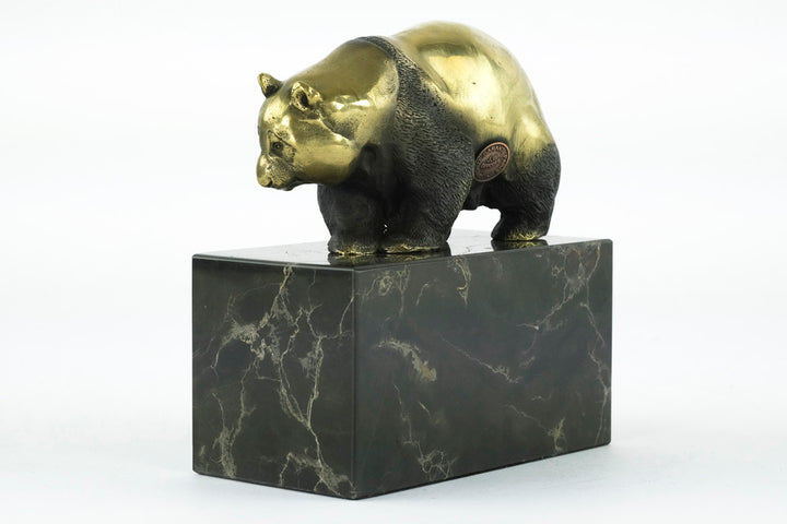 Bronze sculpture of a walking panda bear