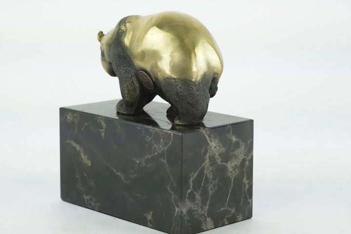 Bronze sculpture of a walking panda bear