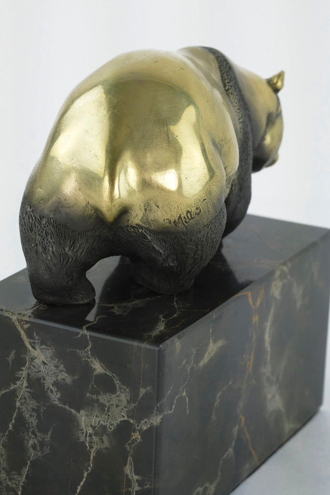Bronze sculpture of a walking panda bear