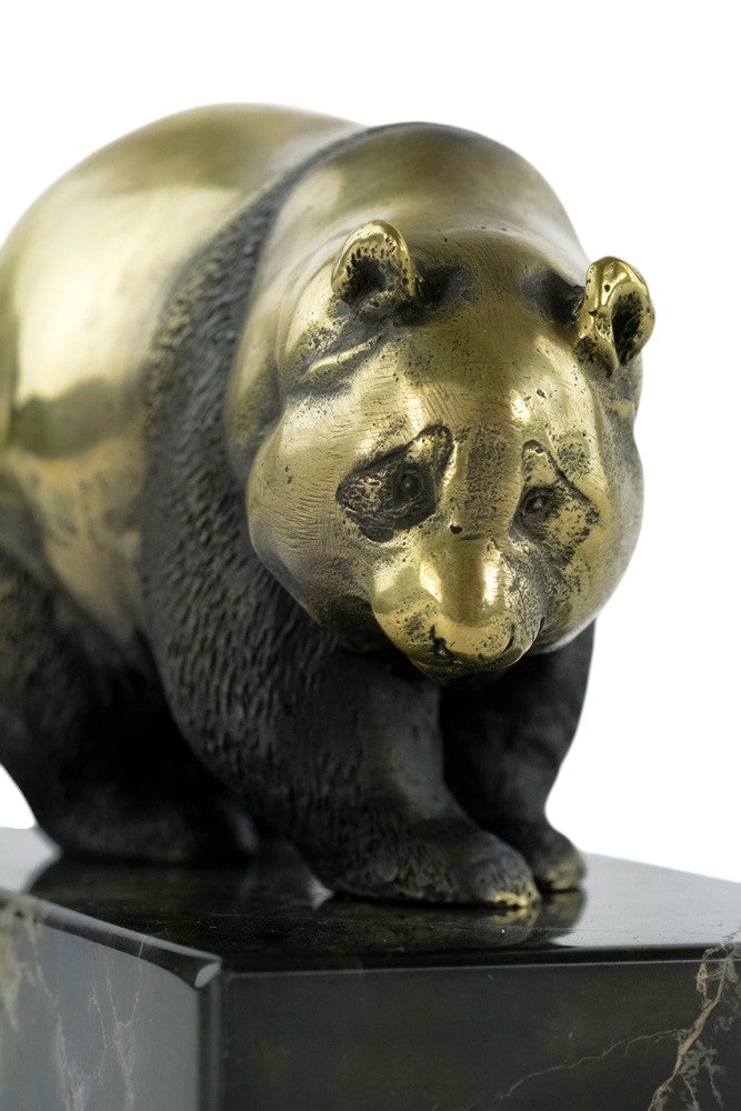 Bronze sculpture of a walking panda bear
