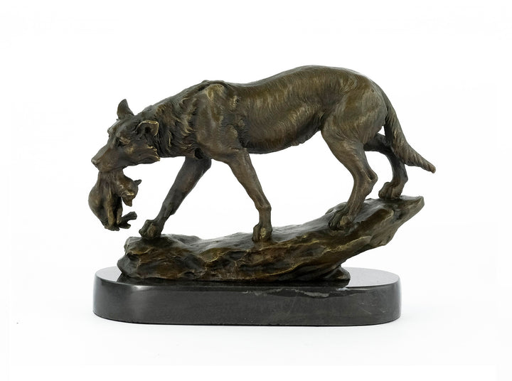 Bronze sculpture of a wolf carrying her young