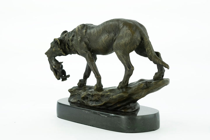 Bronze sculpture of a wolf carrying her young