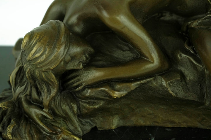 Bronze sculpture of a female sleeping on a rock - inspired by Rodin