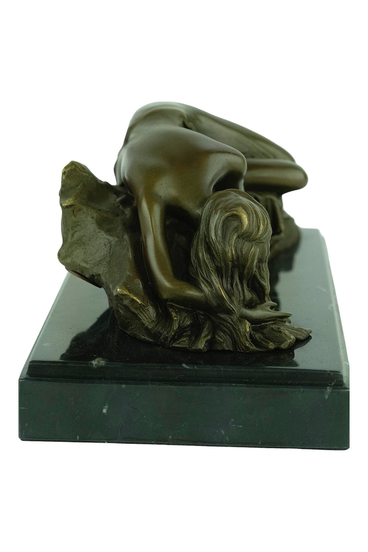 Bronze sculpture of a female sleeping on a rock - inspired by Rodin