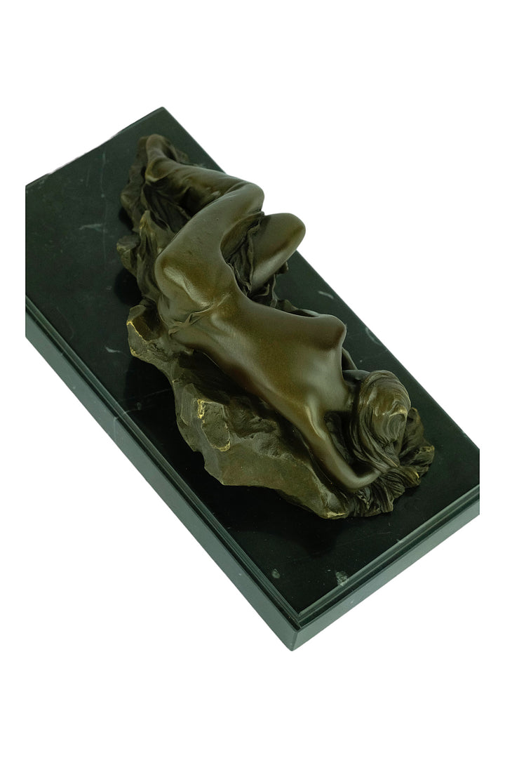 Bronze sculpture of a female sleeping on a rock - inspired by Rodin