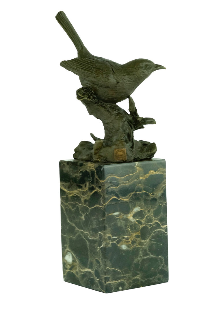 Bronze sculpture of a warbler bird sitting on a branch