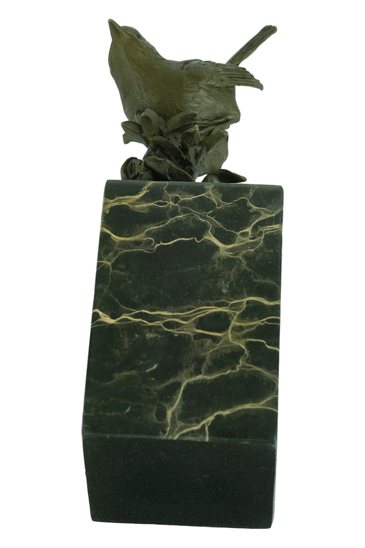 Bronze sculpture of a warbler bird sitting on a branch