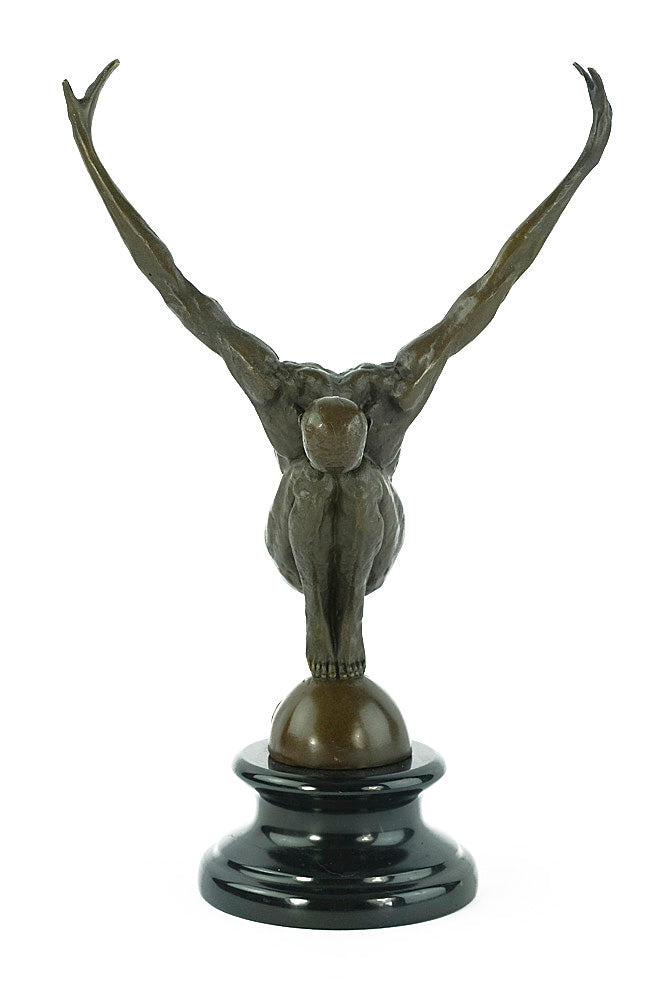 Bronze sculpture of a male with outstretched arms