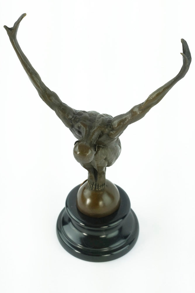 Bronze sculpture of a male with outstretched arms