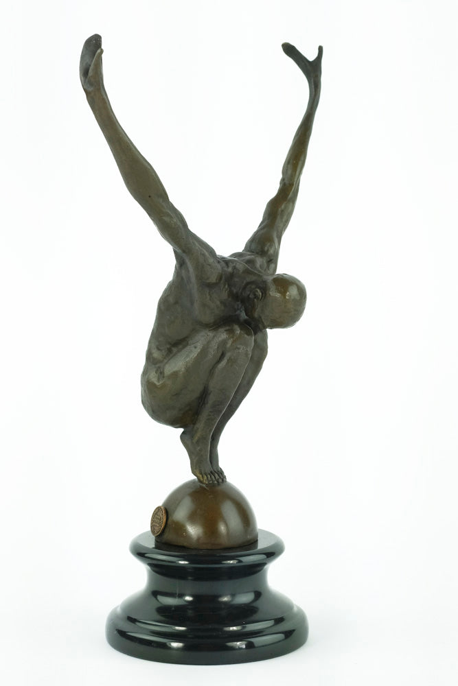 Bronze sculpture of a male with outstretched arms