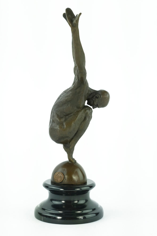 Bronze sculpture of a male with outstretched arms