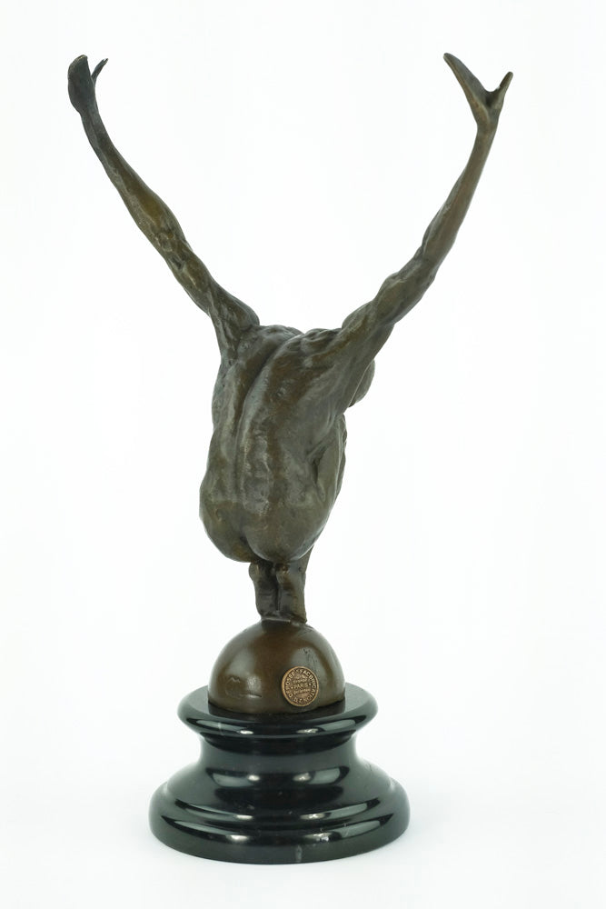 Bronze sculpture of a male with outstretched arms
