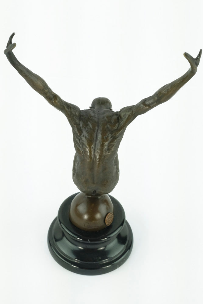 Bronze sculpture of a male with outstretched arms