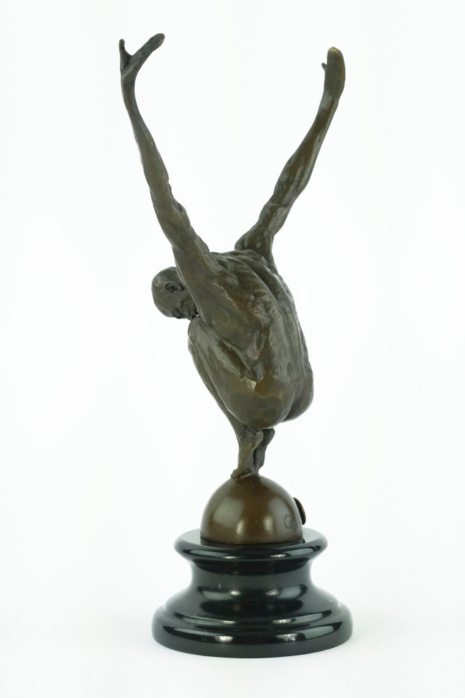 Bronze sculpture of a male with outstretched arms