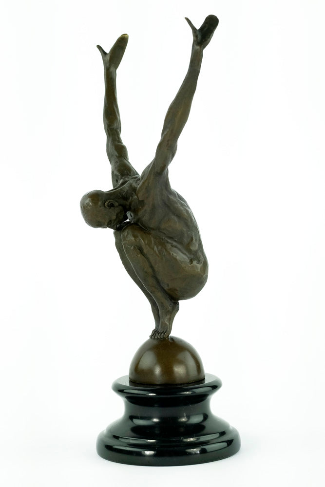 Bronze sculpture of a male with outstretched arms