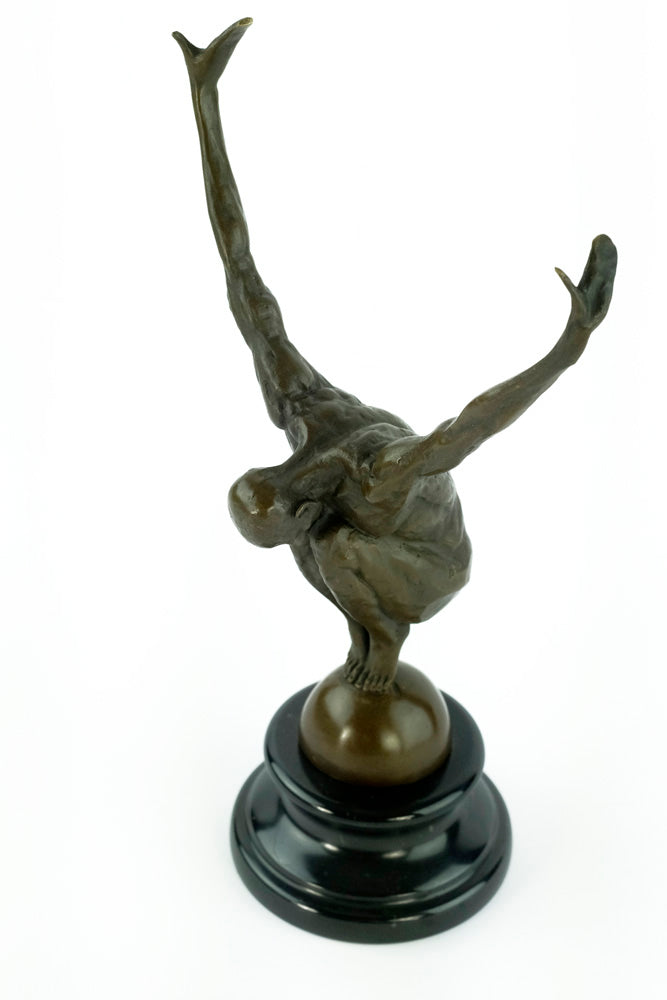 Bronze sculpture of a male with outstretched arms