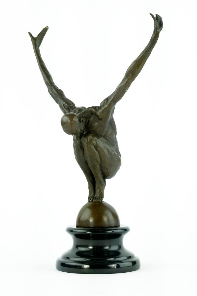Bronze sculpture of a male with outstretched arms