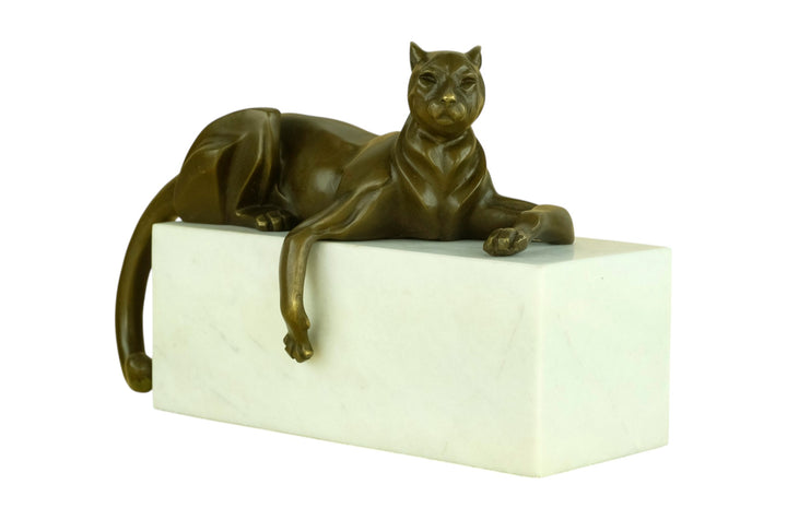 Bronze sculpture of a cubist style panther lying on a white marble base