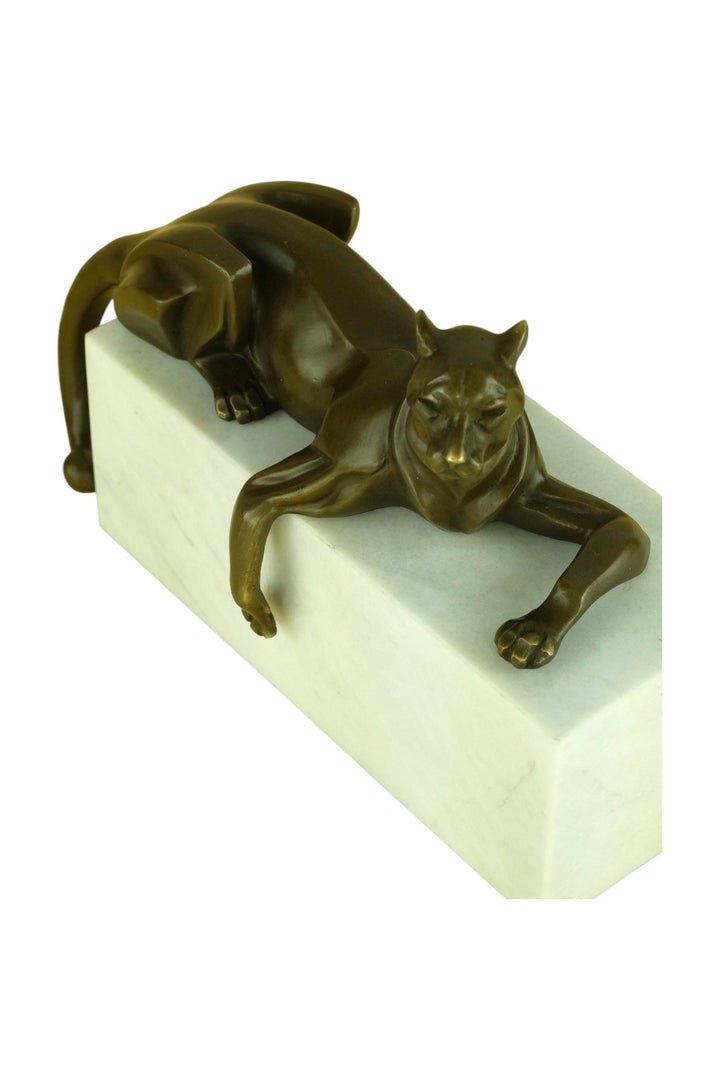 Bronze sculpture of a cubist style panther lying on a white marble base