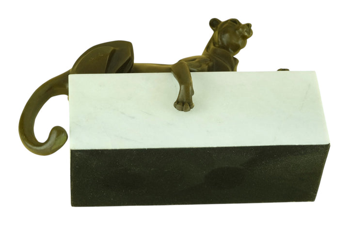 Bronze sculpture of a cubist style panther lying on a white marble base