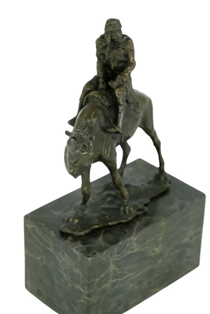 Bronze sculpture of a camel with bedouin rider