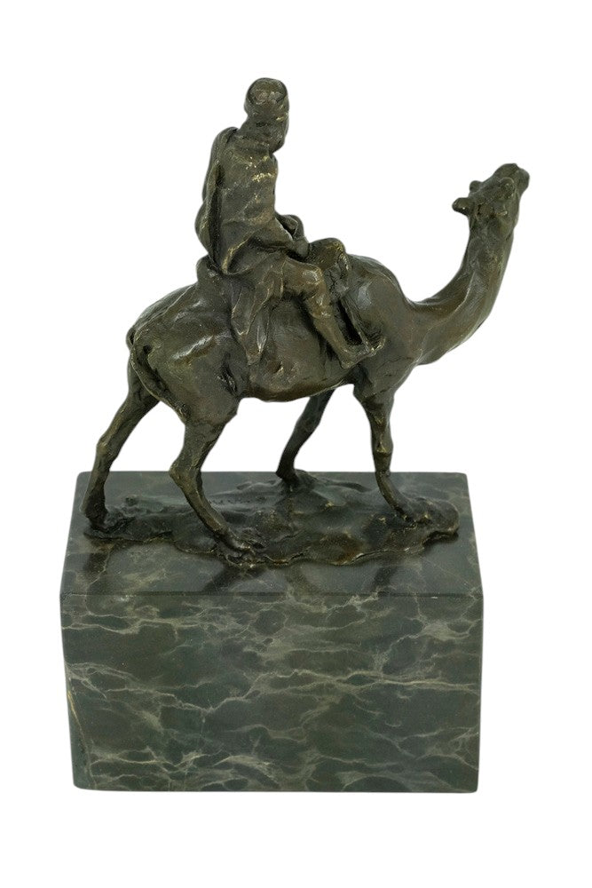 Bronze sculpture of a camel with bedouin rider