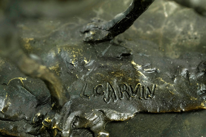 Bronze sculpture of a camel with bedouin rider