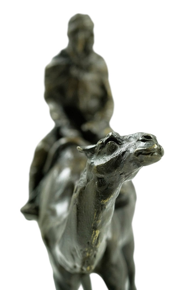 Bronze sculpture of a camel with bedouin rider