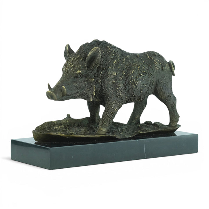 Bronze sculpture of a wild boar on a marble plateau