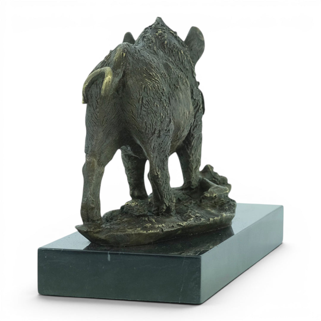 Bronze sculpture of a wild boar on a marble plateau