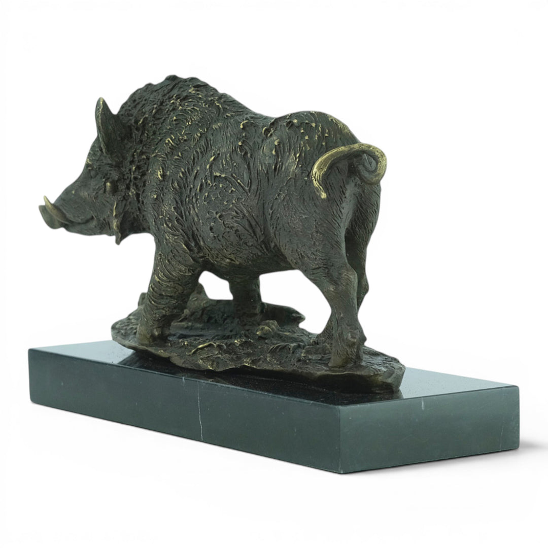 Bronze sculpture of a wild boar on a marble plateau