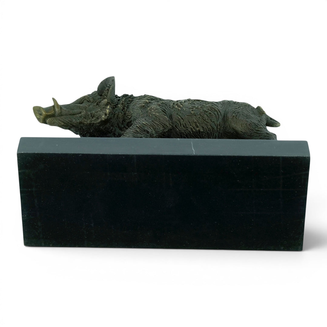 Bronze sculpture of a wild boar on a marble plateau