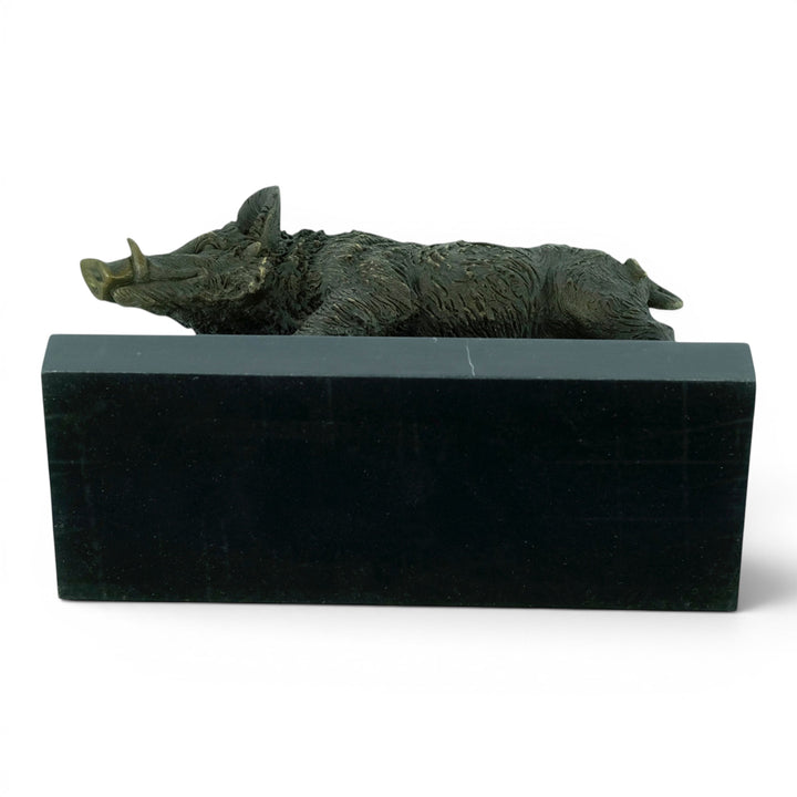 Bronze sculpture of a wild boar on a marble plateau