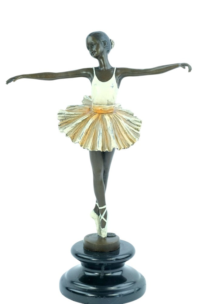 Bronze sculpture of a ballerina standing tip-toe wearing a white tutu