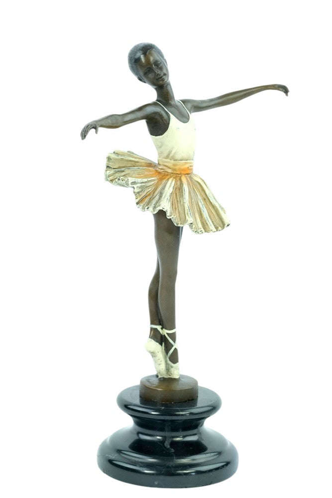 Bronze sculpture of a ballerina standing tip-toe wearing a white tutu