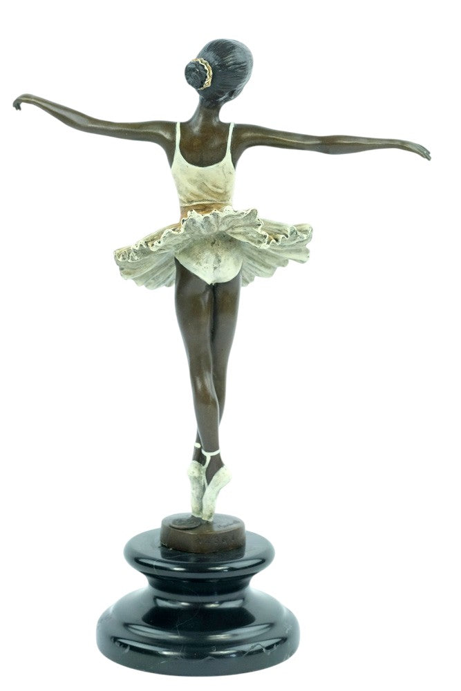 Bronze sculpture of a ballerina standing tip-toe wearing a white tutu