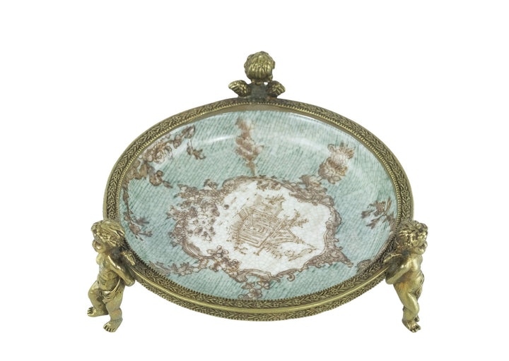 Porcelain bowl carried by three bronze cherubs