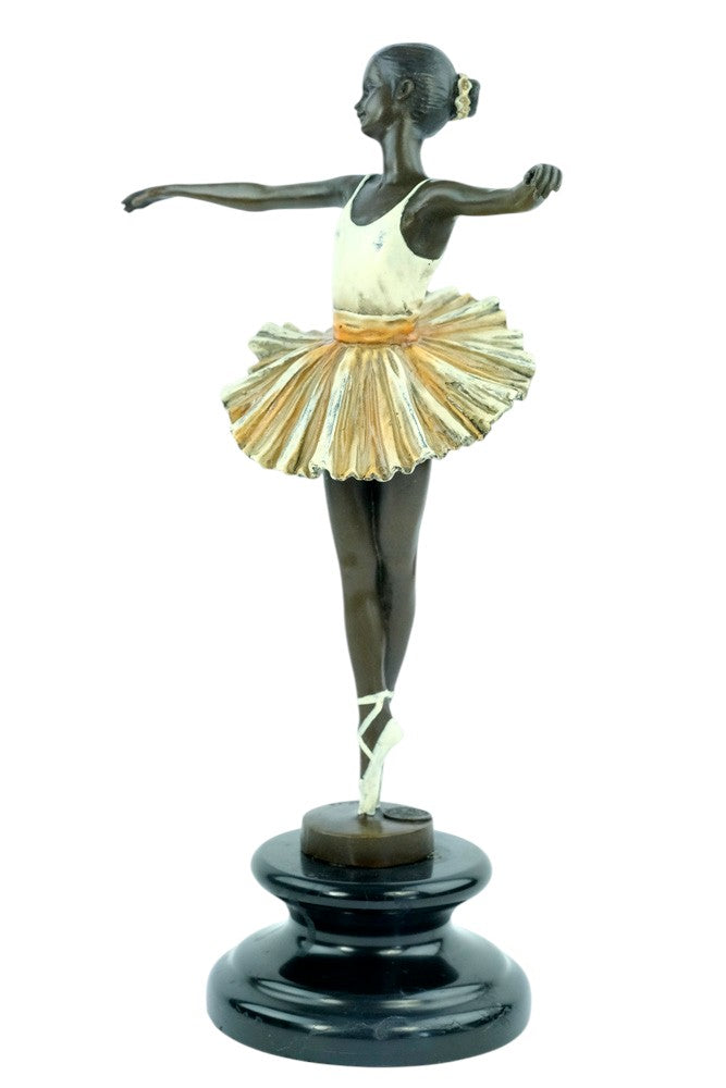 Bronze sculpture of a ballerina standing tip-toe wearing a white tutu