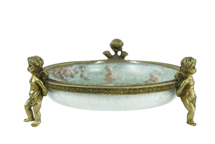 Porcelain bowl carried by three bronze cherubs