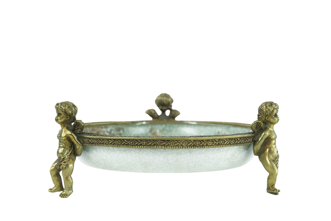 Porcelain bowl carried by three bronze cherubs