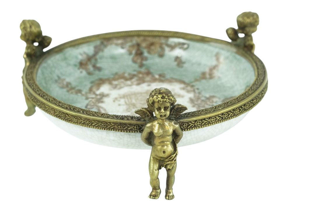 Porcelain bowl carried by three bronze cherubs