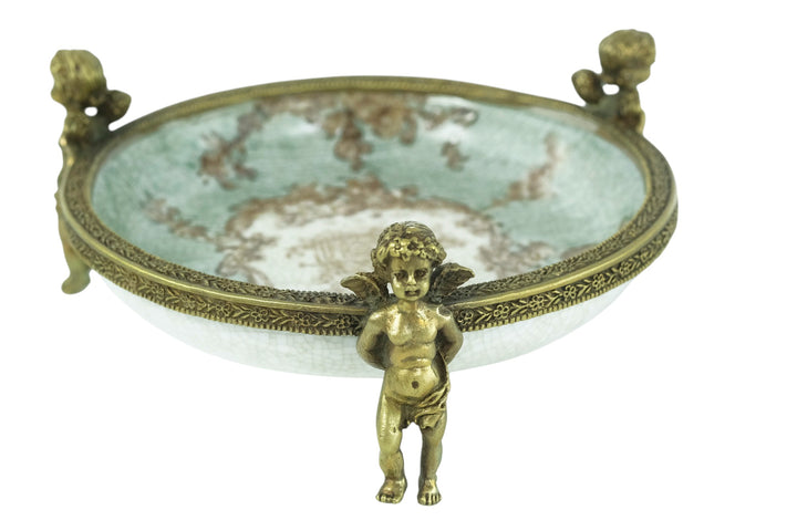 Porcelain bowl carried by three bronze cherubs
