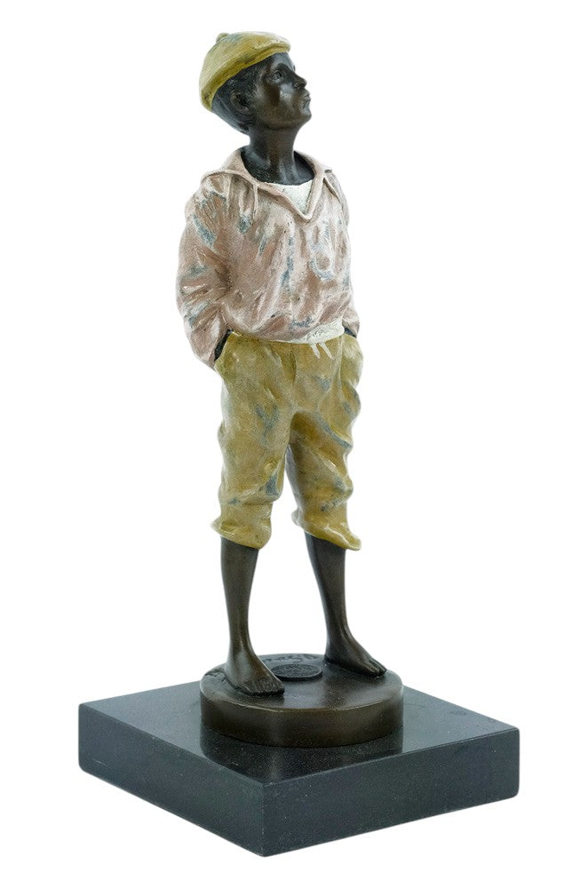 Bronze sculpture of a young street boy whistling