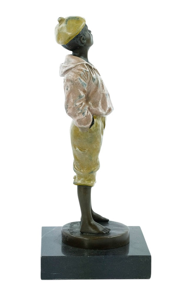 Bronze sculpture of a young street boy whistling