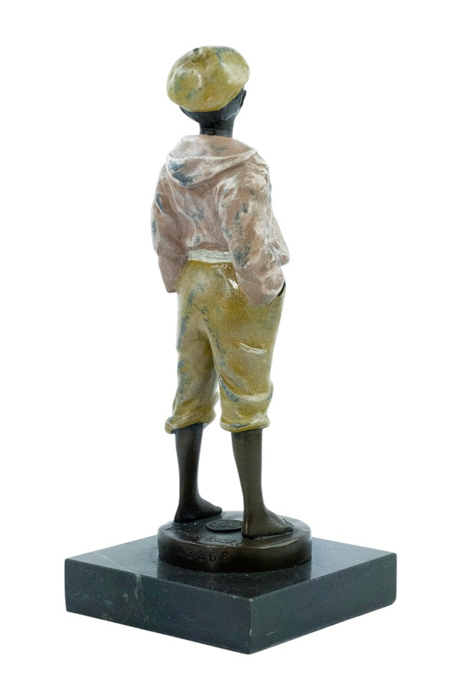 Bronze sculpture of a young street boy whistling