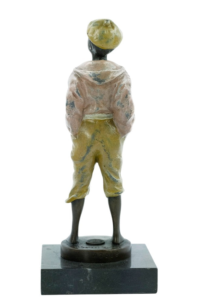 Bronze sculpture of a young street boy whistling