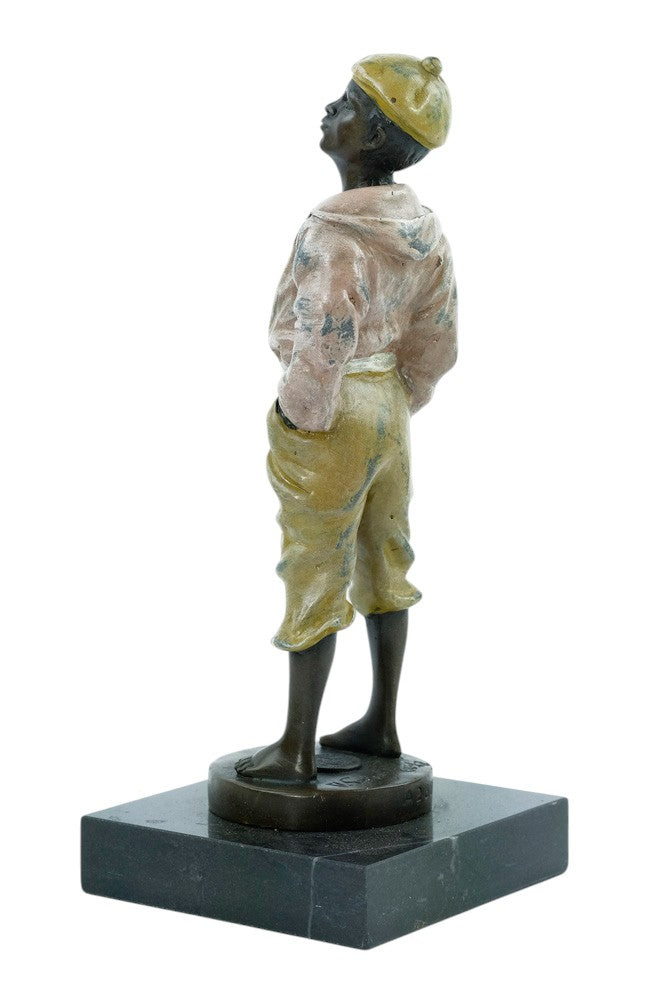 Bronze sculpture of a young street boy whistling
