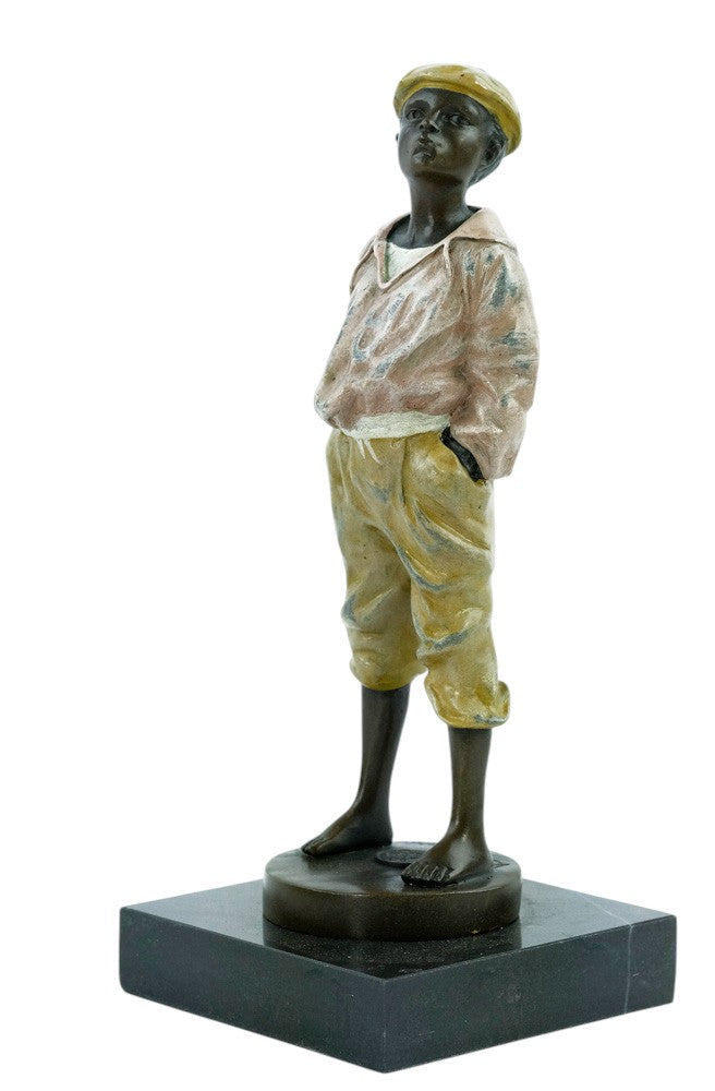 Bronze sculpture of a young street boy whistling