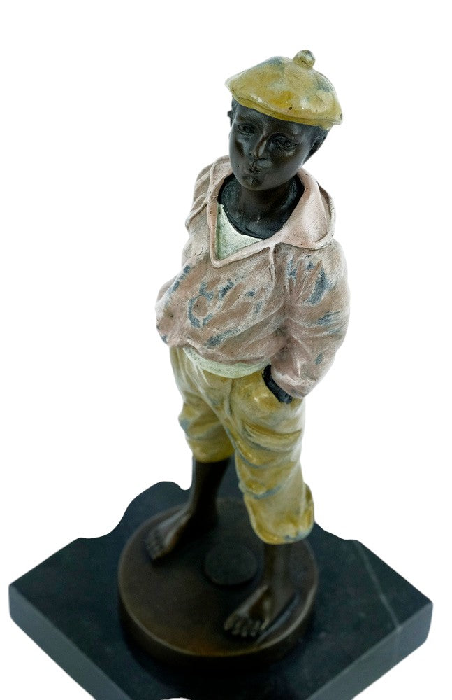 Bronze sculpture of a young street boy whistling