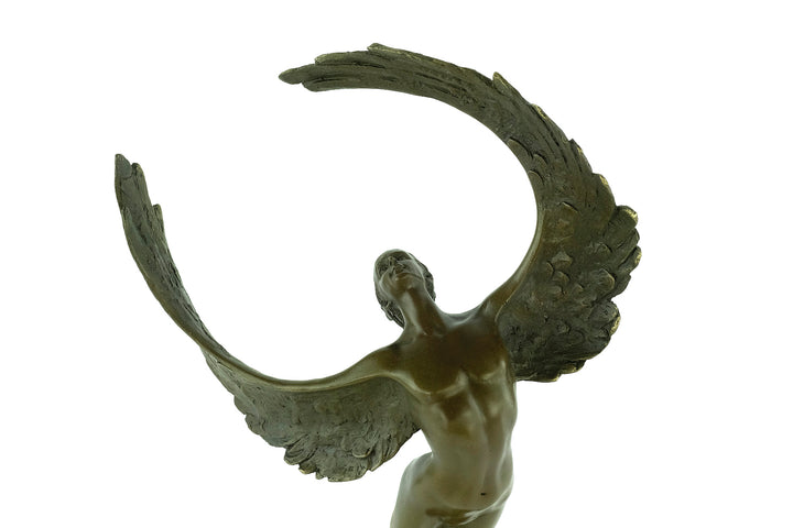 Bronze sculpture of a winged female in rising motion